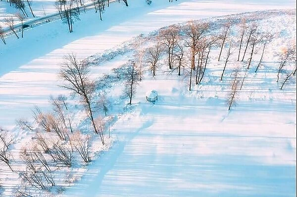 Aerial View Flight Above Frozen Creek. Amazing Aerial View On Freezing River. Scenic View Of Nature. Snowy Winter Sunny Day