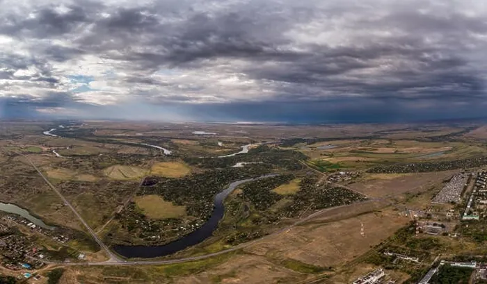Framed Print : Aerial view on flowing river and town. Akhtuba River and Volga River Framed Print : Aerial view on flowing river and town. Akhtuba River and Volga River