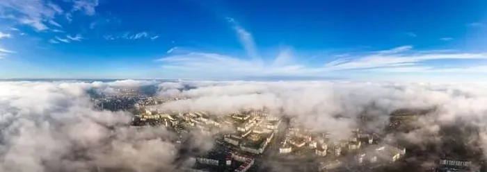 Framed Print : Top aerial view of fluffy white clouds over modern city with high rise buildings Framed Print : Top aerial view of fluffy white clouds over modern city with high rise buildings