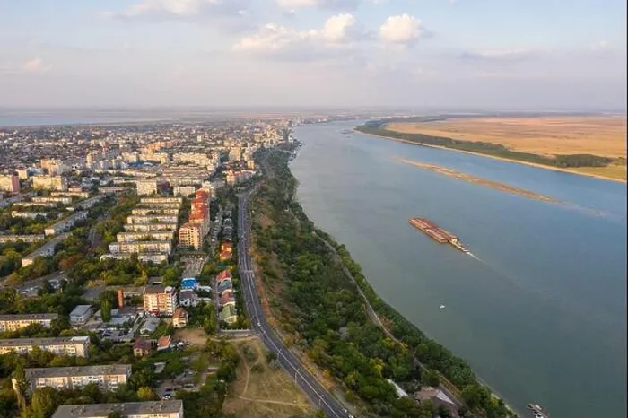 Framed Print : Aerial view of Galati City, Romania. Danube River near city with sunset warm light Framed Print : Aerial view of Galati City, Romania. Danube River near city with sunset warm light
