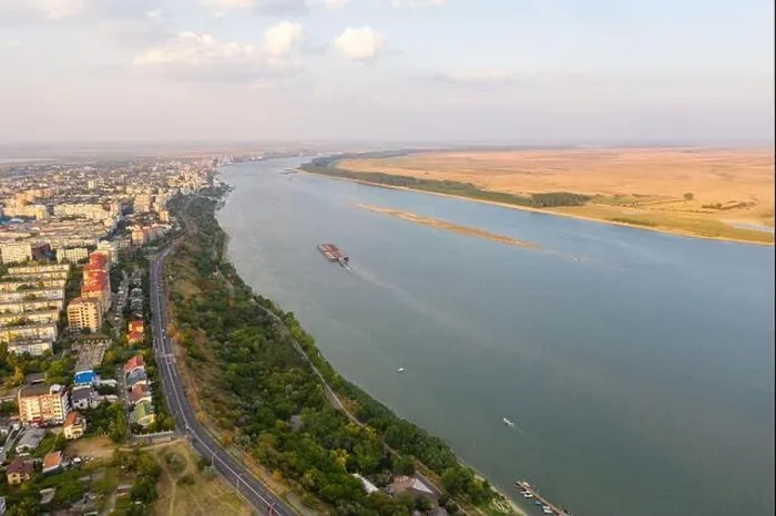 Framed Print : Aerial view of Galati City, Romania. Danube River near city with sunset warm light Framed Print : Aerial view of Galati City, Romania. Danube River near city with sunset warm light
