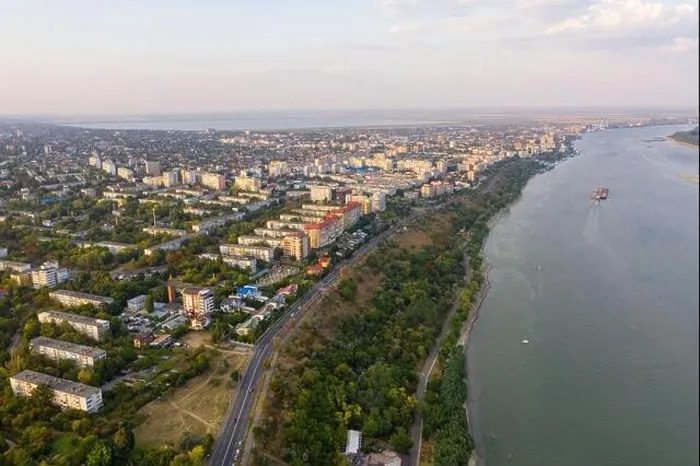 Framed Print : Aerial view of Galati City, Romania. Danube River near city with sunset warm light Framed Print : Aerial view of Galati City, Romania. Danube River near city with sunset warm light