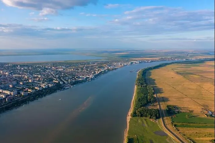 Framed Print : Aerial view of Galati City, Romania. Danube River near city with sunset warm light Framed Print : Aerial view of Galati City, Romania. Danube River near city with sunset warm light