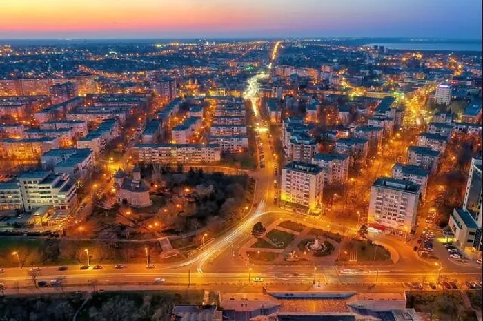 Framed Print : Aerial view of Galati City, Romania. Danube River near city with sunset warm light
