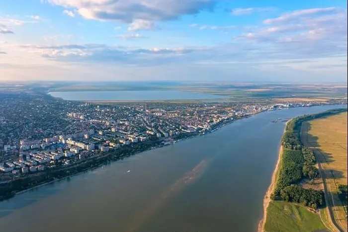 Framed Print : Aerial view of Galati City, Romania. Danube River near city with sunset warm light Framed Print : Aerial view of Galati City, Romania. Danube River near city with sunset warm light