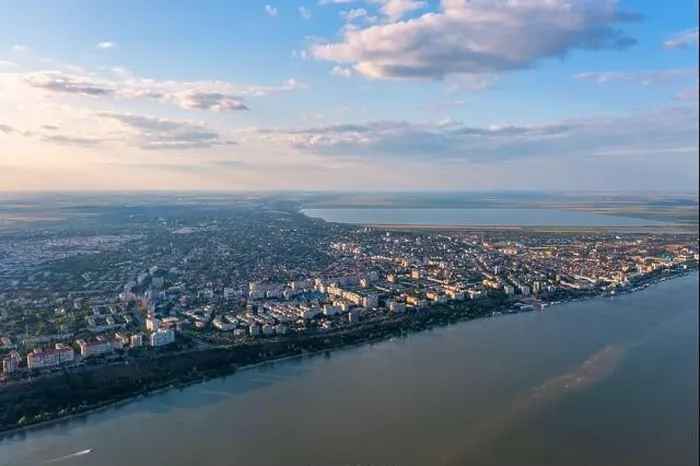 Framed Print : Aerial view of Galati City, Romania. Danube River near city with sunset warm light Framed Print : Aerial view of Galati City, Romania. Danube River near city with sunset warm light