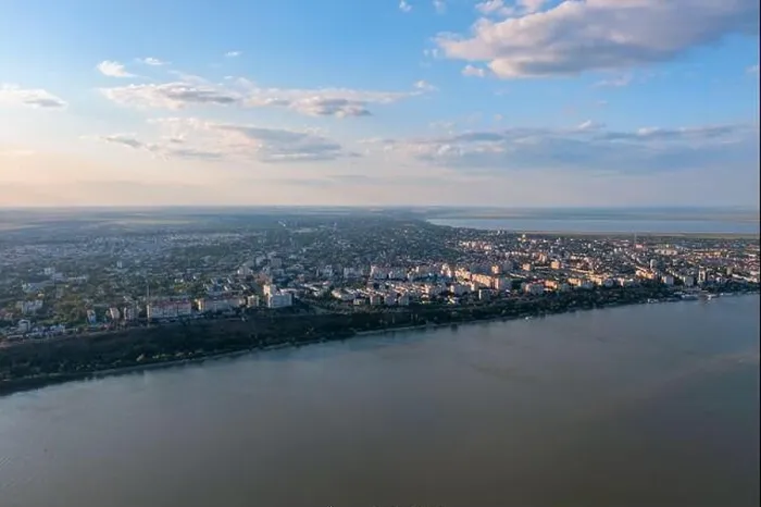 Framed Print : Aerial view of Galati City, Romania. Danube River near city with sunset warm light