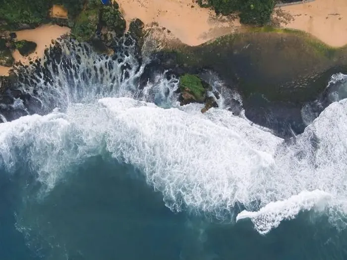 Framed Print : Top down aerial view of giant ocean waves crashing and foaming in coral beach Framed Print : Top down aerial view of giant ocean waves crashing and foaming in coral beach