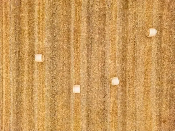 Framed Print : Aerial view of four hay bales on a dry stubble field with cracks in the ground, Hesse, Germany Framed Print : Aerial view of four hay bales on a dry stubble field with cracks in the ground, Hesse, Germany