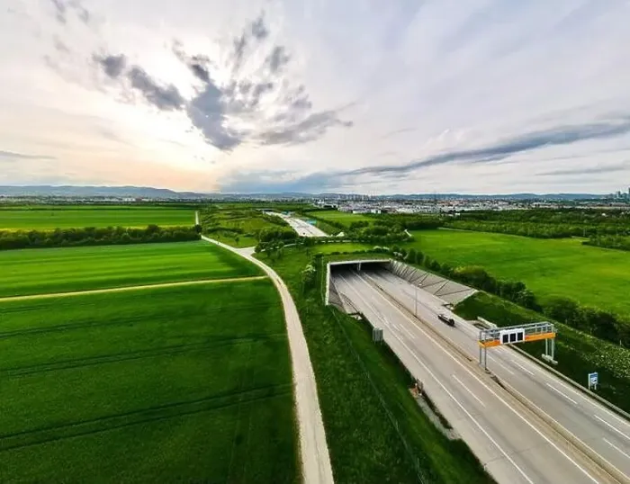 Framed Print : Aerial view of Highway with ecoduct bridge overpass for wild animals and pedestrians Framed Print : Aerial view of Highway with ecoduct bridge overpass for wild animals and pedestrians