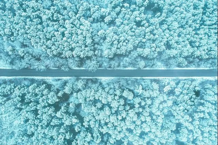 Framed Print : Aerial view of highway road through snow blue forest landscape in winter. Toned photo. Top view flat view of highway motorway freeway from high Framed Print : Aerial view of highway road through snow blue forest landscape in winter. Toned photo. Top view flat view of highway motorway freeway from high