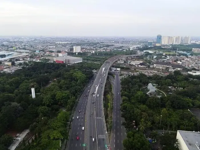 Framed Print : Aerial view of highways and buildings when sunset and noise cloud. Bekasi, Indonesia, March 21, 2021 Framed Print : Aerial view of highways and buildings when sunset and noise cloud. Bekasi, Indonesia, March 21, 2021