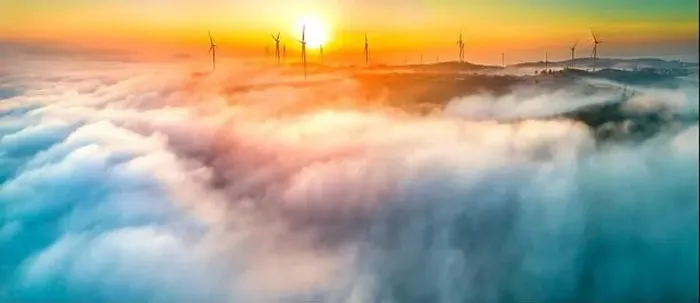 Framed Print : Aerial view top hill at dawn with fog covering small village in valley
