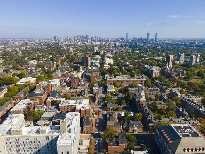 Framed Print : Aerial view of historic city center of Cambridge on Mt Auburn Street with Boston modern city skyline at the background Framed Print : Aerial view of historic city center of Cambridge on Mt Auburn Street with Boston modern city skyline at the background