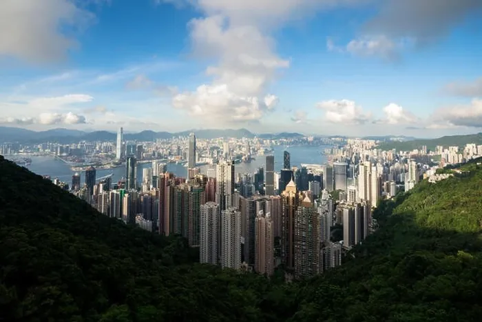 Framed Print : Aerial view of Hong Kong skyline and Victoria Harbor with blue sky in Hong Kong. Asia Framed Print : Aerial view of Hong Kong skyline and Victoria Harbor with blue sky in Hong Kong. Asia