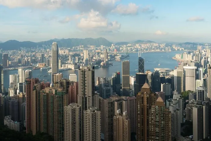 Framed Print : Aerial view of Hong Kong skyline and Victoria Harbor with blue sky in Hong Kong. Asia Framed Print : Aerial view of Hong Kong skyline and Victoria Harbor with blue sky in Hong Kong. Asia