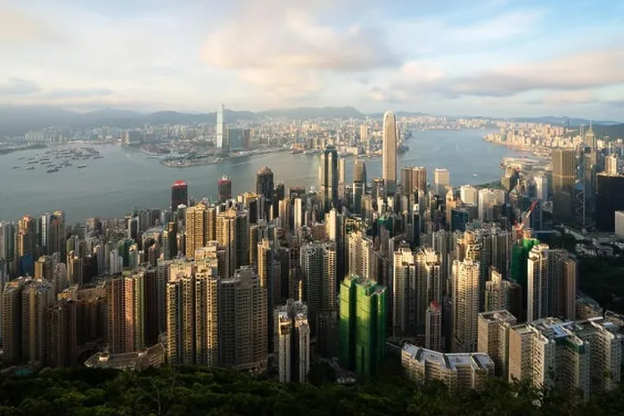 Framed Print : Aerial view of Hong Kong skyline and Victoria Harbor with blue sky in Hong Kong. Asia Framed Print : Aerial view of Hong Kong skyline and Victoria Harbor with blue sky in Hong Kong. Asia