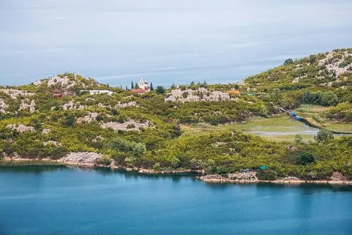 Framed Print : Aerial view of the island monastery on Lake Skadar, Montenegro, surrounded by pristine blue waters Framed Print : Aerial view of the island monastery on Lake Skadar, Montenegro, surrounded by pristine blue waters