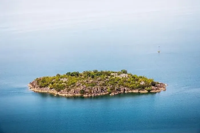 Framed Print : Aerial view of the island monastery on Lake Skadar, Montenegro, surrounded by pristine blue waters Framed Print : Aerial view of the island monastery on Lake Skadar, Montenegro, surrounded by pristine blue waters