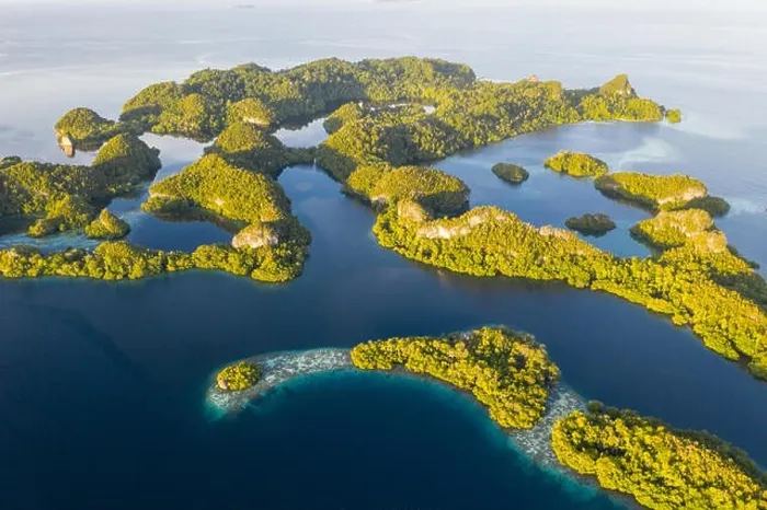Framed Print : An aerial view of islands in Raja Ampat. This area is the heart of marine biodiversity and is a popular destination for scuba divers and snorkelers Framed Print : An aerial view of islands in Raja Ampat. This area is the heart of marine biodiversity and is a popular destination for scuba divers and snorkelers