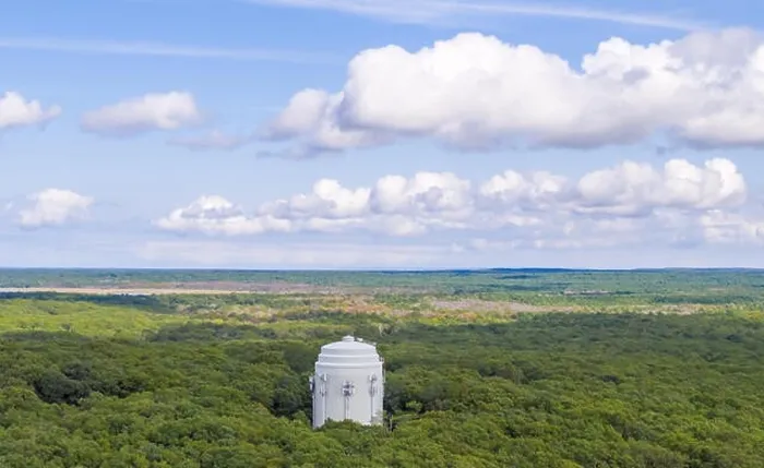 Framed Print : Aerial view of a large white water tower in Sag Harbor, NY