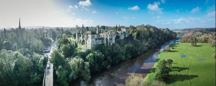 Framed Print : Aerial view of Lismore Castle, Ireland, showcasing its stunning Gothic architecture and scenic riverside location Framed Print : Aerial view of Lismore Castle, Ireland, showcasing its stunning Gothic architecture and scenic riverside location