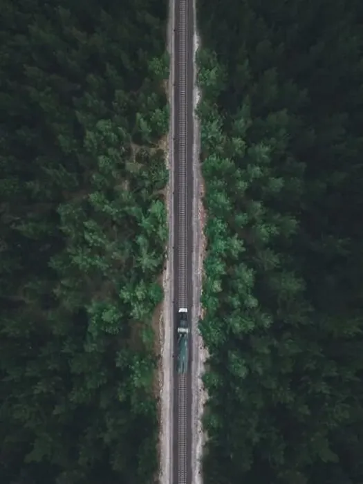 Framed Print : Aerial view of the locomotive traveling on the railway through the forest in autumn, shot by drone with motion blur Framed Print : Aerial view of the locomotive traveling on the railway through the forest in autumn, shot by drone with motion blur