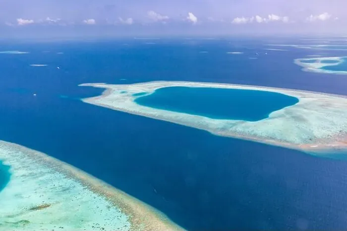Framed Print : Aerial view of Maldives atolls is the world top beauty. Maldives tourism. Indian ocean with Maldivian island, aerial photography Framed Print : Aerial view of Maldives atolls is the world top beauty. Maldives tourism. Indian ocean with Maldivian island, aerial photography