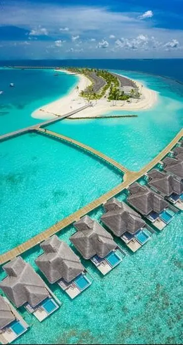 Framed Print : Aerial view of Maldives island, luxury water villas resort and wooden pier. Beautiful sky and ocean lagoon beach background. Summer vacation holiday Framed Print : Aerial view of Maldives island, luxury water villas resort and wooden pier. Beautiful sky and ocean lagoon beach background. Summer vacation holiday