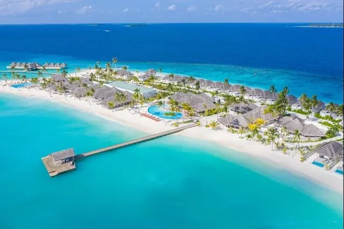 Framed Print : Aerial view of Maldives island, luxury water villas resort and wooden pier. Beautiful sky and ocean lagoon beach background. Summer vacation holiday Framed Print : Aerial view of Maldives island, luxury water villas resort and wooden pier. Beautiful sky and ocean lagoon beach background. Summer vacation holiday