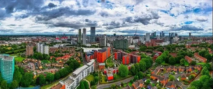 Framed Print : Aerial view of Manchester cityscape with skyscrapers and construction sites