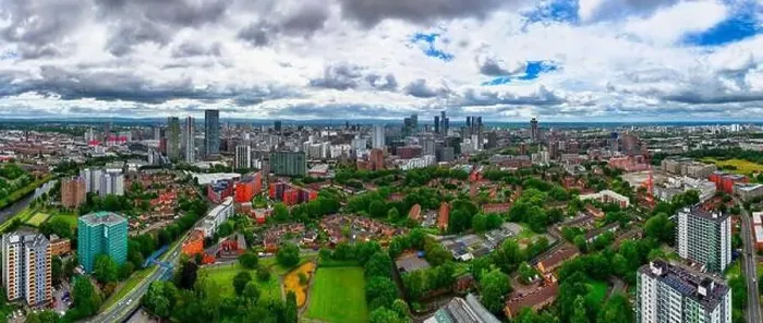 Framed Print : Aerial view of Manchester cityscape with skyscrapers and construction sites Framed Print : Aerial view of Manchester cityscape with skyscrapers and construction sites