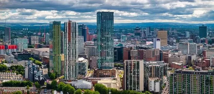 Framed Print : Aerial view of Manchester cityscape with skyscrapers and construction sites Framed Print : Aerial view of Manchester cityscape with skyscrapers and construction sites