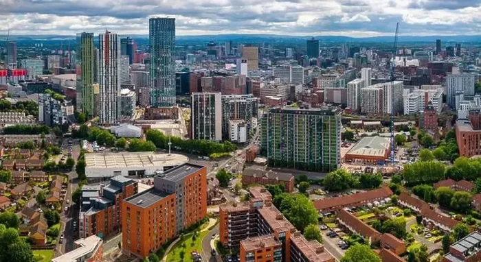 Framed Print : Aerial view of Manchester cityscape with skyscrapers and construction sites Framed Print : Aerial view of Manchester cityscape with skyscrapers and construction sites