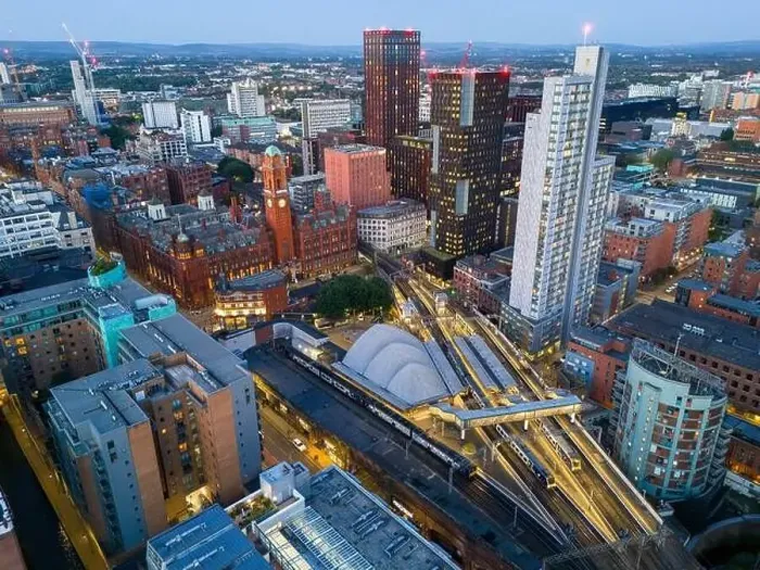 Framed Print : Aerial view of Manchester cityscape with skyscrapers and construction sites Framed Print : Aerial view of Manchester cityscape with skyscrapers and construction sites