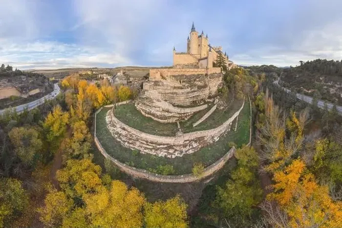 Framed Print : From above aerial view of medieval castle Alcazar of Segovia Spain located on hill with autumn trees next to meandering Framed Print : From above aerial view of medieval castle Alcazar of Segovia Spain located on hill with autumn trees next to meandering