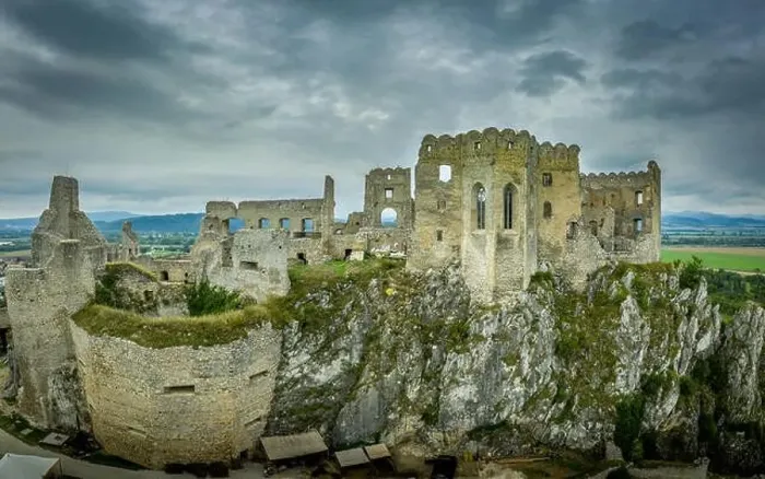 Framed Print : Aerial view of medieval ruined Beckov castle in Slovakia above the Vah river with Gothic chapel and stormy sky Framed Print : Aerial view of medieval ruined Beckov castle in Slovakia above the Vah river with Gothic chapel and stormy sky