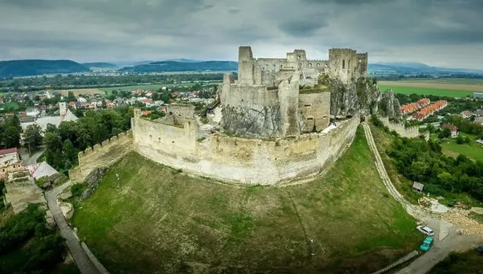 Framed Print : Aerial view of medieval ruined Beckov castle in Slovakia above the Vah river with Gothic chapel and stormy sky Framed Print : Aerial view of medieval ruined Beckov castle in Slovakia above the Vah river with Gothic chapel and stormy sky
