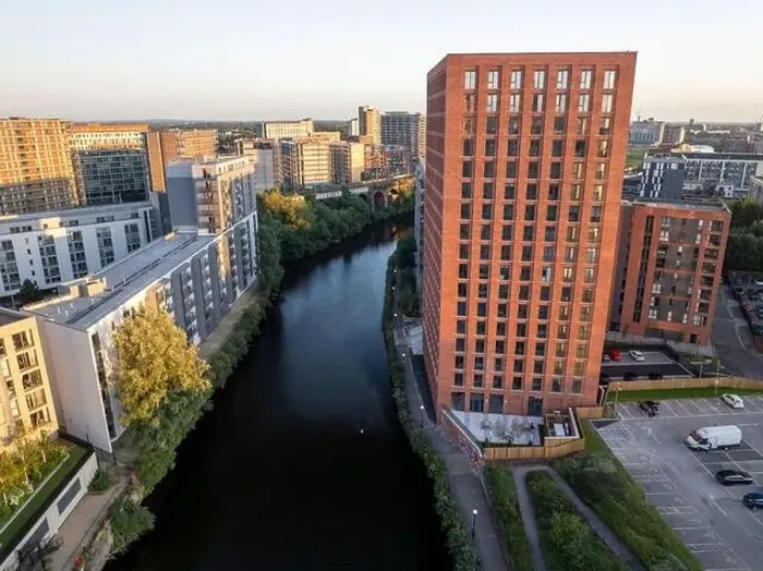 Framed Print : Aerial view of modern apartment buildings with the river Irwell and city skyline in the background Framed Print : Aerial view of modern apartment buildings with the river Irwell and city skyline in the background