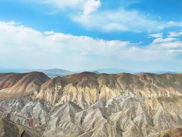 Framed Print : Aerial view mountain over blue sky. Drone view mountain valley. Beautiful view from above surface of mountain hills Framed Print : Aerial view mountain over blue sky. Drone view mountain valley. Beautiful view from above surface of mountain hills
