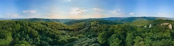 Framed Print : Aerial view of mountain hills covered with dense green lush woods on bright summer day Framed Print : Aerial view of mountain hills covered with dense green lush woods on bright summer day