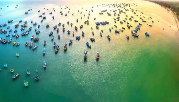 Framed Print : Aerial view of Mui Ne fishing village in the morning with hundreds of boats anchored to avoid storms Framed Print : Aerial view of Mui Ne fishing village in the morning with hundreds of boats anchored to avoid storms