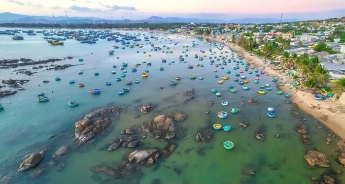 Framed Print : Aerial view of Mui Ne fishing village in the morning with hundreds of boats anchored to avoid storms Framed Print : Aerial view of Mui Ne fishing village in the morning with hundreds of boats anchored to avoid storms