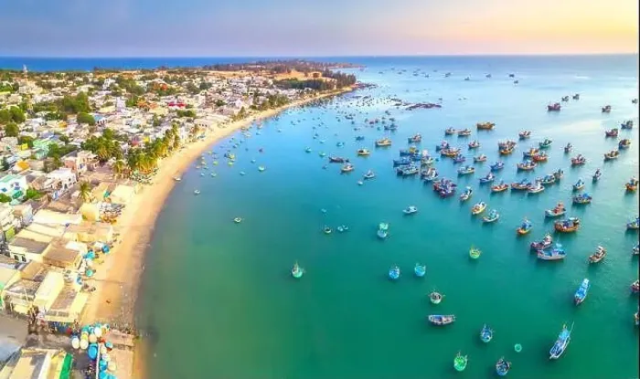 Framed Print : Aerial view of Mui Ne fishing village in the morning with hundreds of boats anchored to avoid storms Framed Print : Aerial view of Mui Ne fishing village in the morning with hundreds of boats anchored to avoid storms