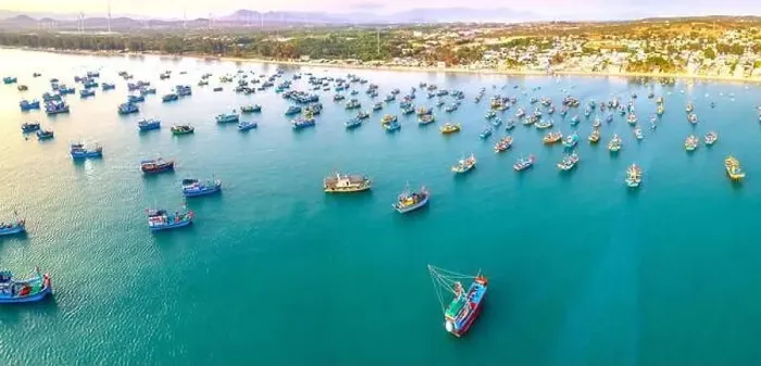 Framed Print : Aerial view of Mui Ne fishing village in the morning with hundreds of boats anchored to avoid storms Framed Print : Aerial view of Mui Ne fishing village in the morning with hundreds of boats anchored to avoid storms