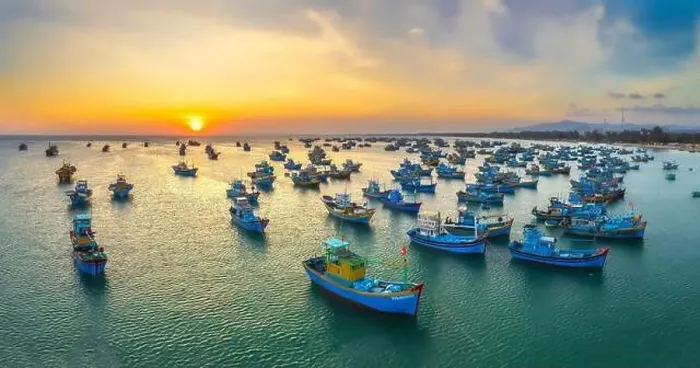 Framed Print : Aerial view of Mui Ne fishing village in sunset sky with hundreds of boats anchored to avoid storms Framed Print : Aerial view of Mui Ne fishing village in sunset sky with hundreds of boats anchored to avoid storms