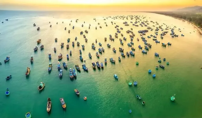Framed Print : Aerial view of Mui Ne fishing village in sunset sky with hundreds of boats anchored to avoid storms Framed Print : Aerial view of Mui Ne fishing village in sunset sky with hundreds of boats anchored to avoid storms