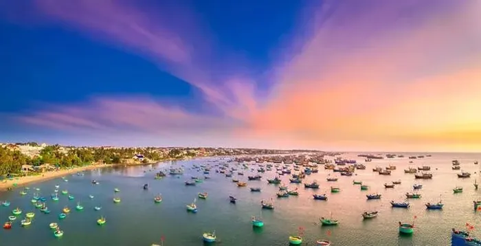 Framed Print : Aerial view of Mui Ne fishing village in sunset sky with hundreds of boats anchored to avoid storms Framed Print : Aerial view of Mui Ne fishing village in sunset sky with hundreds of boats anchored to avoid storms