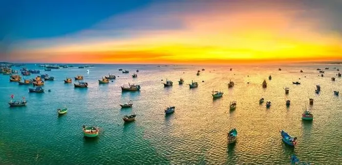 Framed Print : Aerial view of Mui Ne fishing village in sunset sky with hundreds of boats anchored to avoid storms Framed Print : Aerial view of Mui Ne fishing village in sunset sky with hundreds of boats anchored to avoid storms