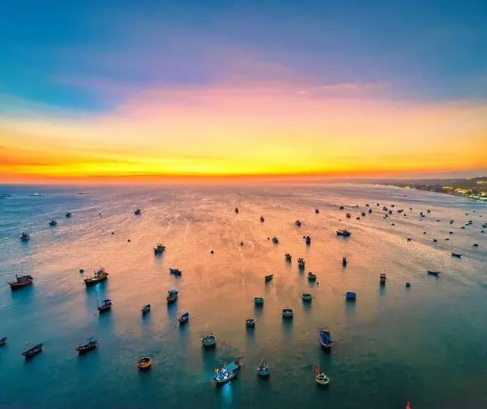 Framed Print : Aerial view of Mui Ne fishing village in sunset sky with hundreds of boats anchored to avoid storms Framed Print : Aerial view of Mui Ne fishing village in sunset sky with hundreds of boats anchored to avoid storms